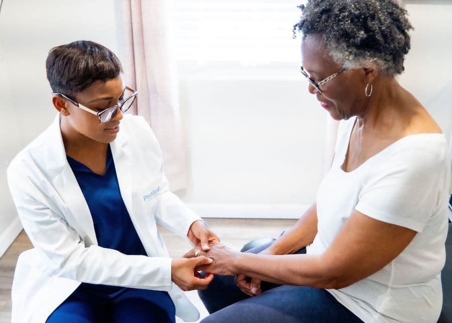 Dr. Jocelyn Nzabalinda treating a patient at Physio First Bermuda
