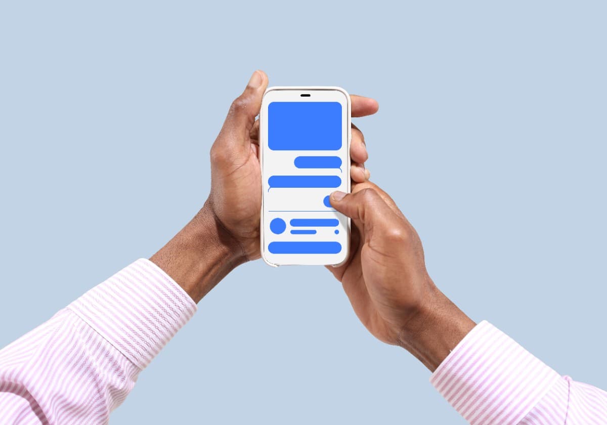 Hands holding a phone to schedule a consultation